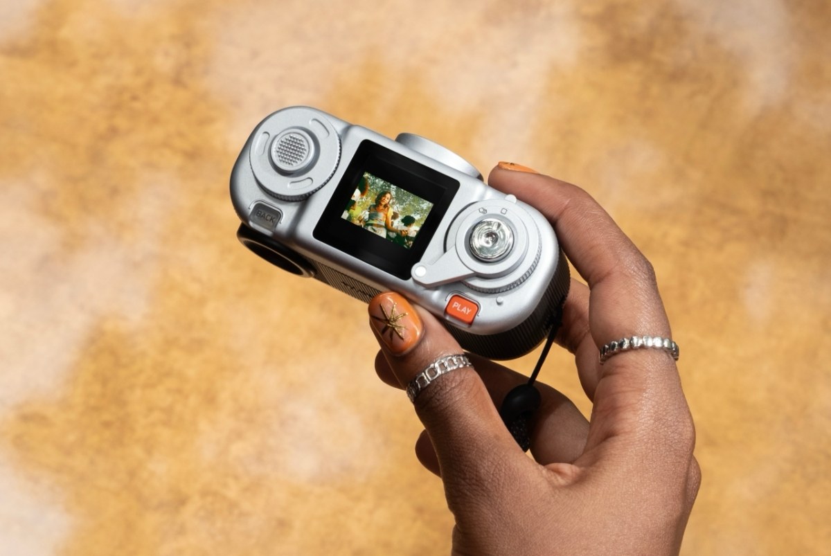 The main upgrades over the first model: a 1/3.06-inch sensor with resolution doubled from 5 to 10 megapixels, on-board storage for 100 shots (up from 50), and microSD card support for more space.