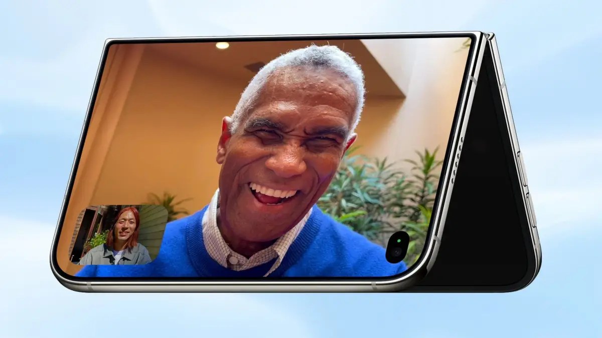 The hinge doubles as a built-in stand, so the phone sits on a table for FaceTime, video, selfies and long exposures. New here: you can take selfies with the 48MP rear camera while using the outer screen as the viewfinder, which a slab iPhone can't do.